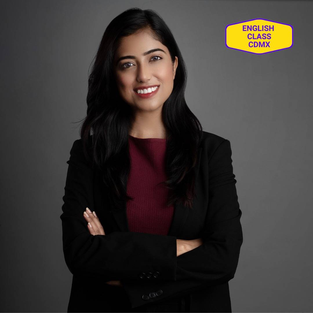 Professional woman in a black blazer smiling confidently, eager to enhance her presentation skills through English coaching. Embracing growth and progress with expert mentoring to become a world-class communicator.