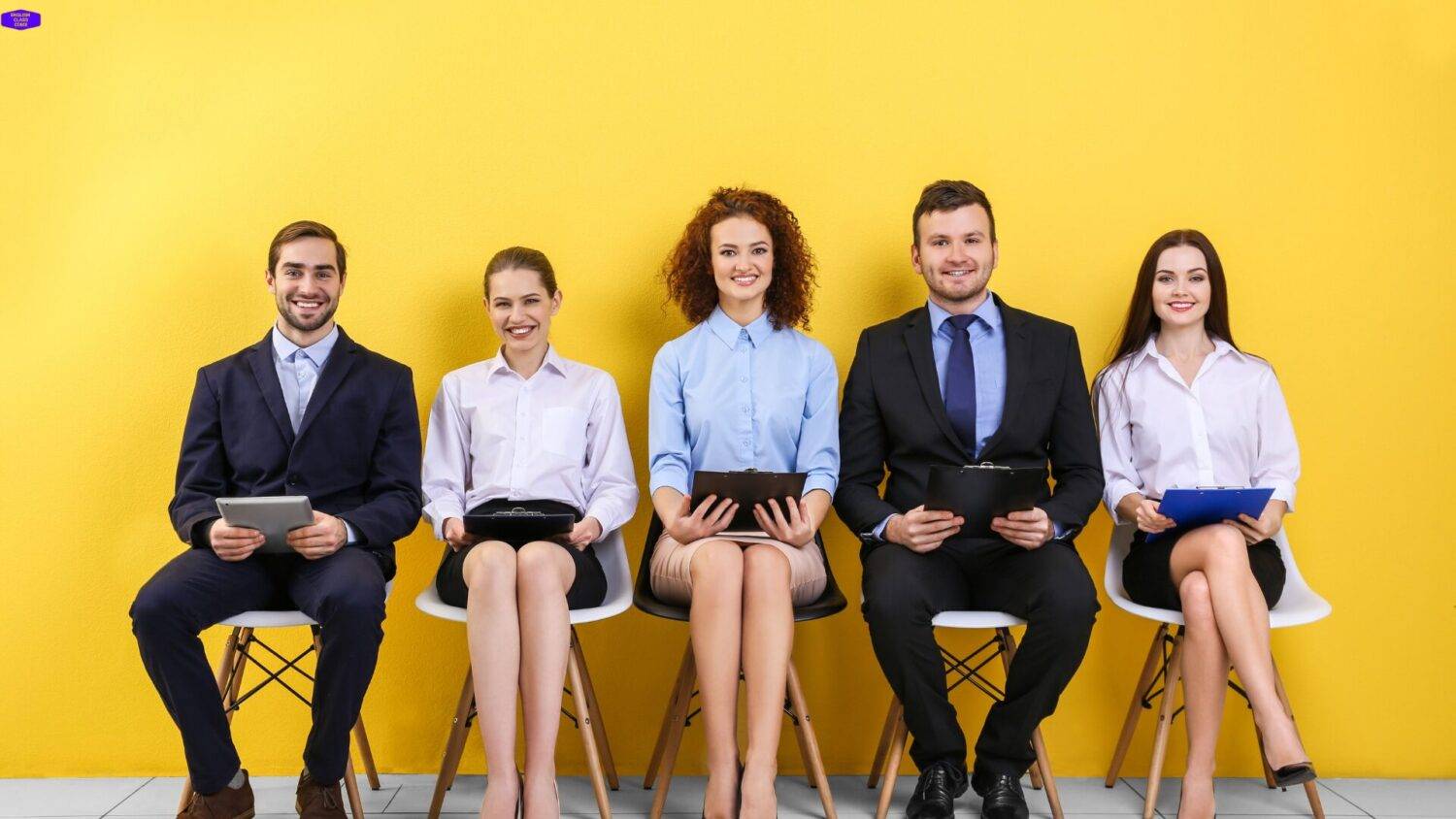 Group of professionally dressed individuals seated with confidence, symbolizing readiness and motivation to begin their English language journey with English Class CDMX.