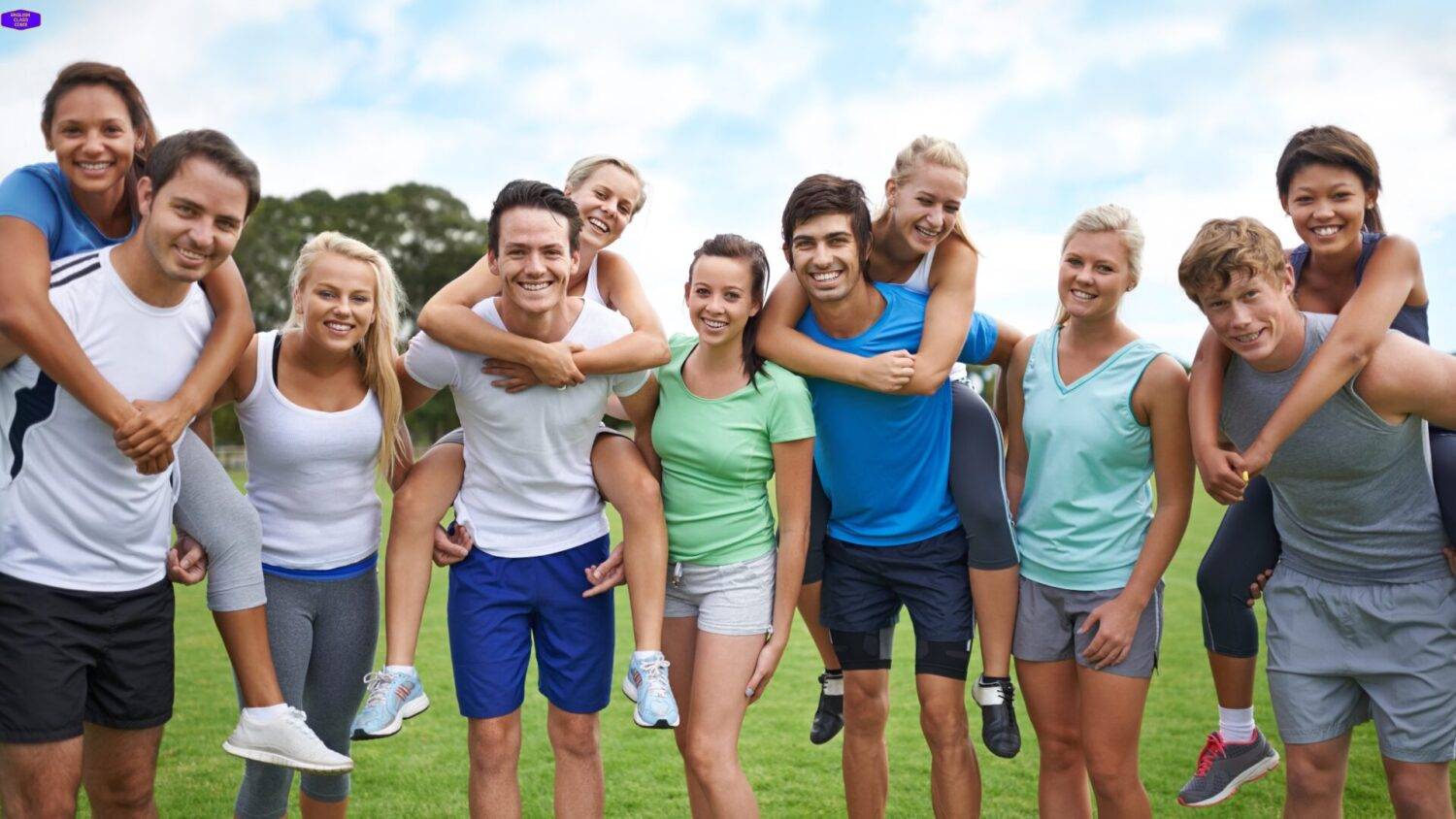 Group of young adults engaging in team-building activities outdoors, symbolizing camaraderie and motivation in the English Essentials Boot Camp