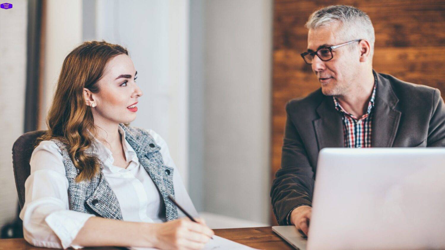 A mentor and mentee engaging in a focused discussion, symbolizing personalized guidance and support offered through mentorships for achieving career and personal growth goals.