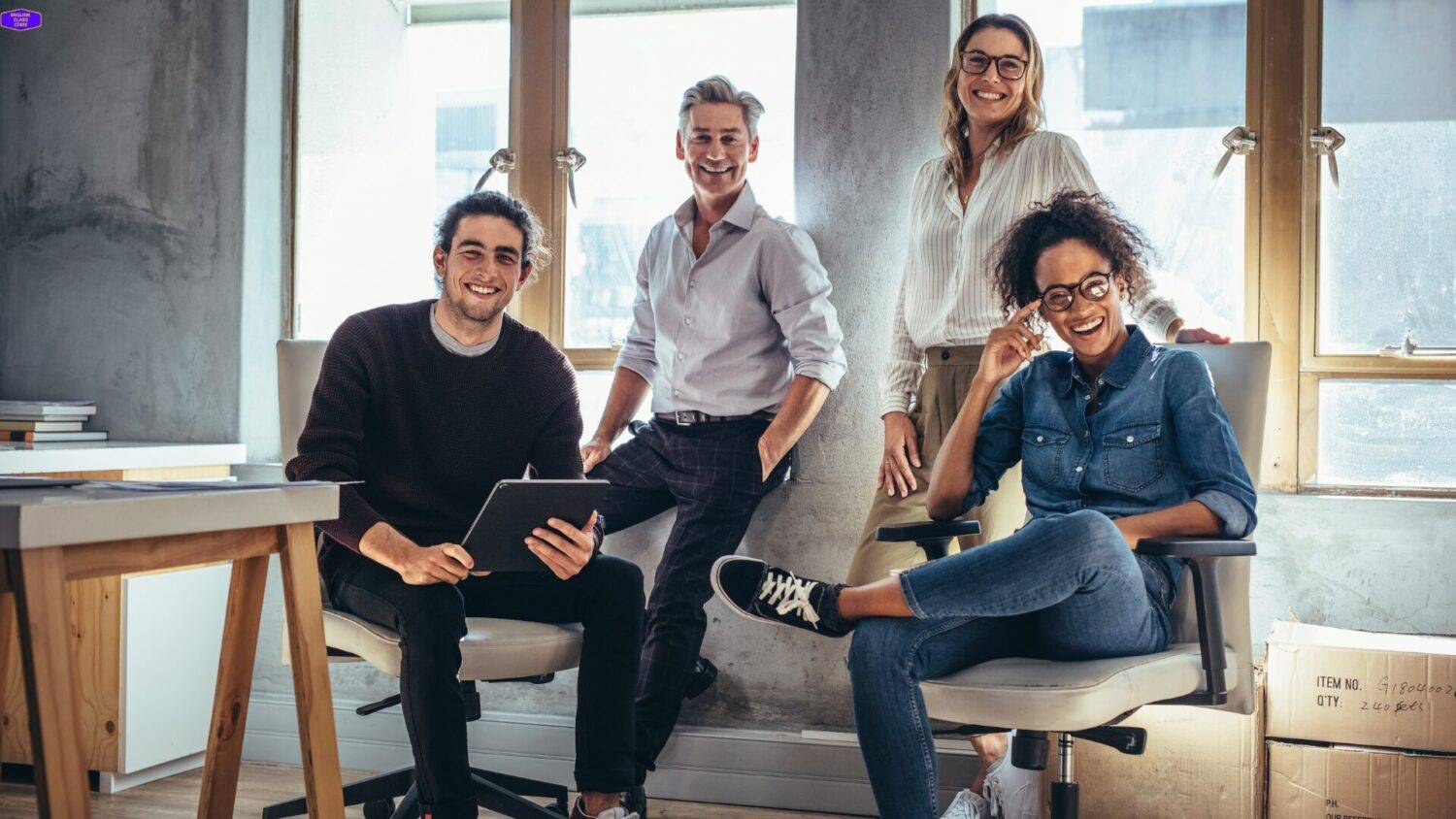 Group of professionals collaborating in a bright office, symbolizing the benefits of investing in personal and professional growth.