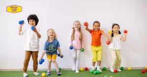 Group of diverse children joyfully playing with colorful balls, emphasizing the fun and engaging environment provided by English Class CDMX for young learners.